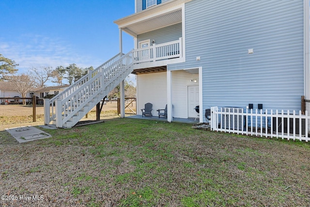 back of property featuring a lawn