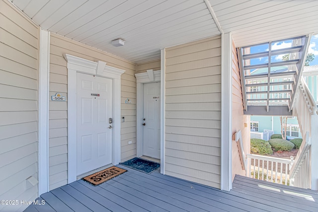 view of exterior entry featuring a porch