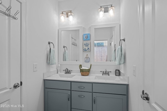 bathroom with a sink and double vanity