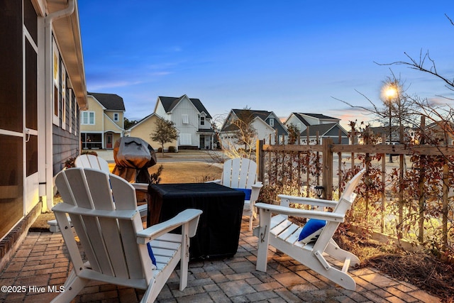 patio terrace at dusk with a residential view