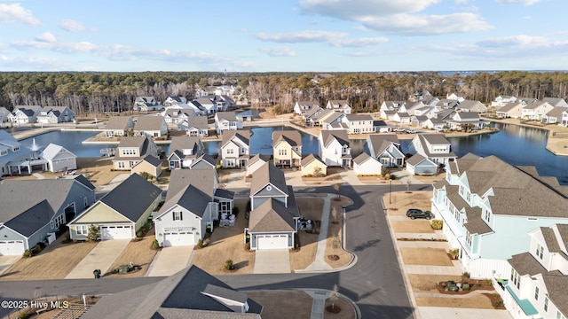 bird's eye view with a water view and a residential view