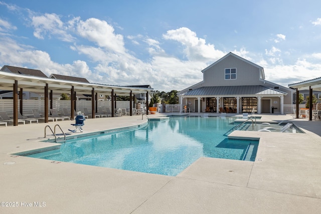 community pool featuring a patio area and fence