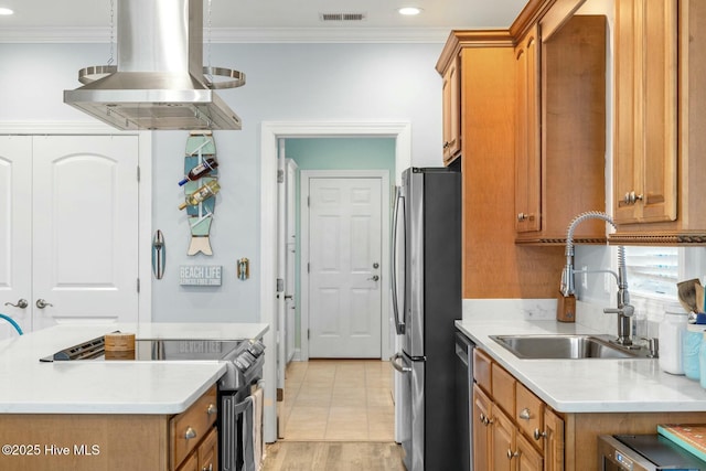 kitchen featuring visible vents, brown cabinets, island exhaust hood, stainless steel appliances, and a sink
