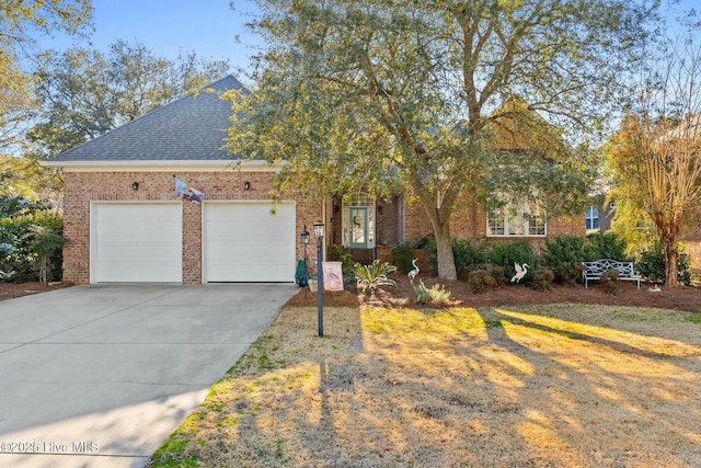 view of front of property featuring brick siding, concrete driveway, an attached garage, and a shingled roof