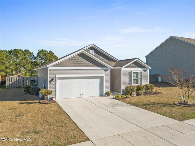 ranch-style house featuring a garage and a front lawn