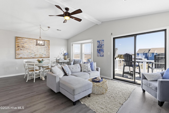 living room with vaulted ceiling with beams, dark wood finished floors, visible vents, a ceiling fan, and baseboards