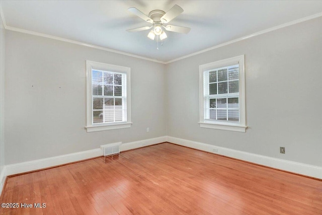 spare room featuring crown molding, light hardwood / wood-style flooring, and ceiling fan