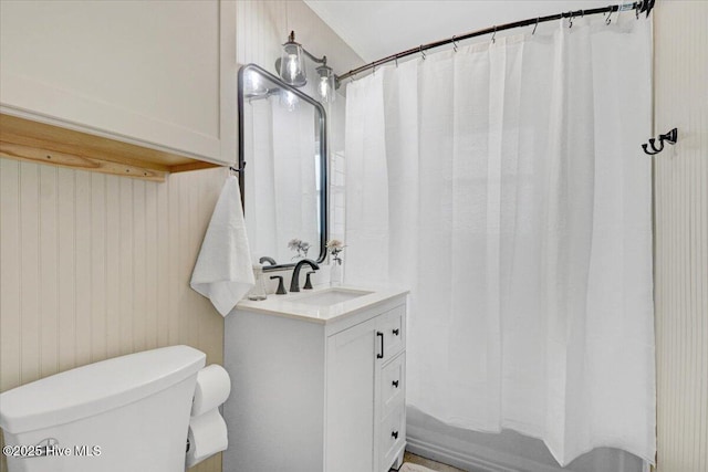 full bathroom featuring vanity, shower / bath combination with curtain, and toilet