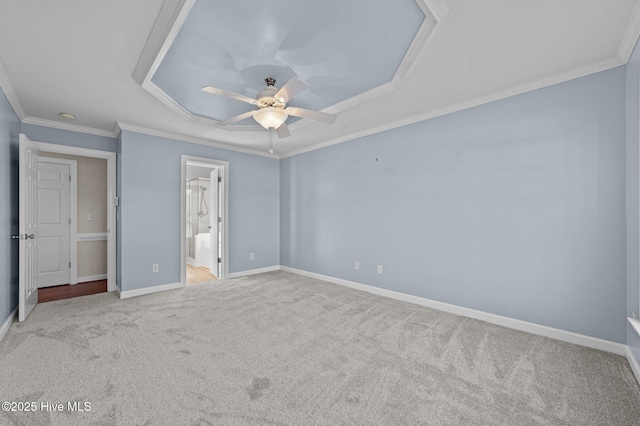 unfurnished bedroom featuring ornamental molding, light colored carpet, ceiling fan, and ensuite bathroom