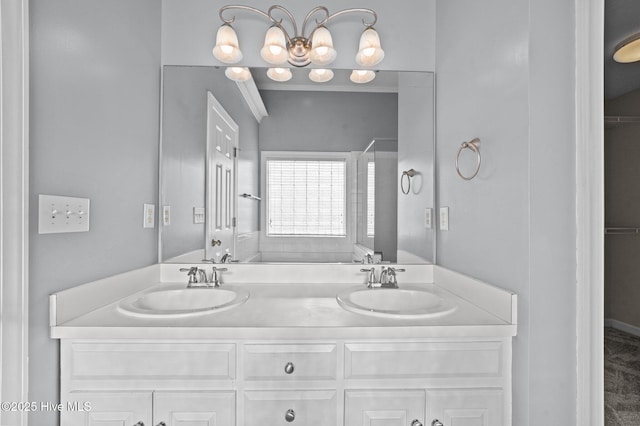 bathroom with vanity and a chandelier