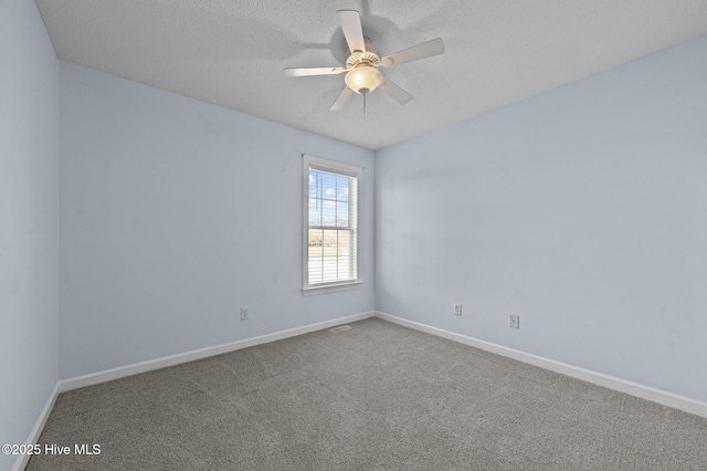 empty room featuring carpet flooring, a textured ceiling, and ceiling fan