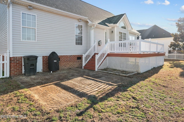 back of house with a wooden deck