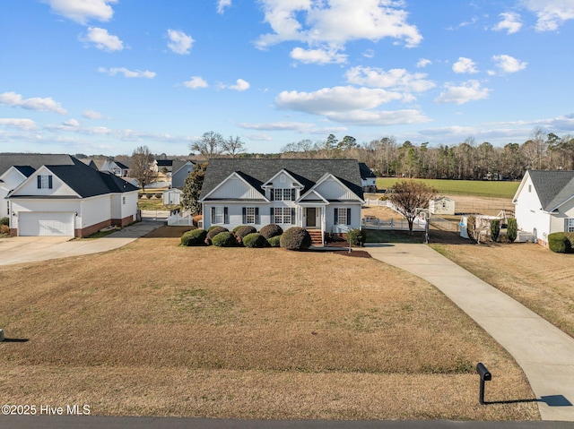 ranch-style house featuring a garage and a front lawn