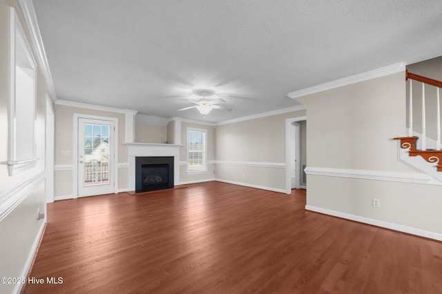 unfurnished living room with crown molding, hardwood / wood-style flooring, and ceiling fan