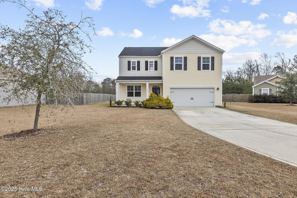 front of property with a garage and a front lawn