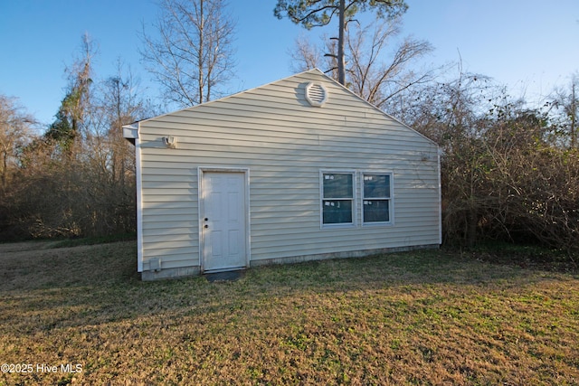 view of outdoor structure with a lawn