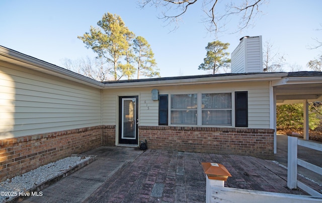 doorway to property featuring a patio area