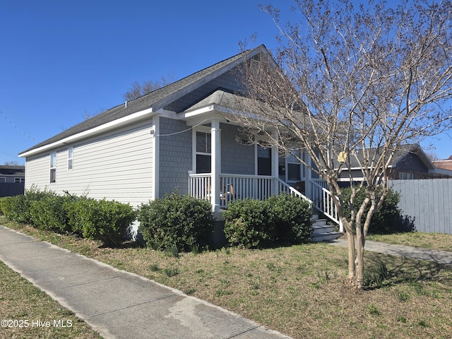 view of home's exterior featuring fence