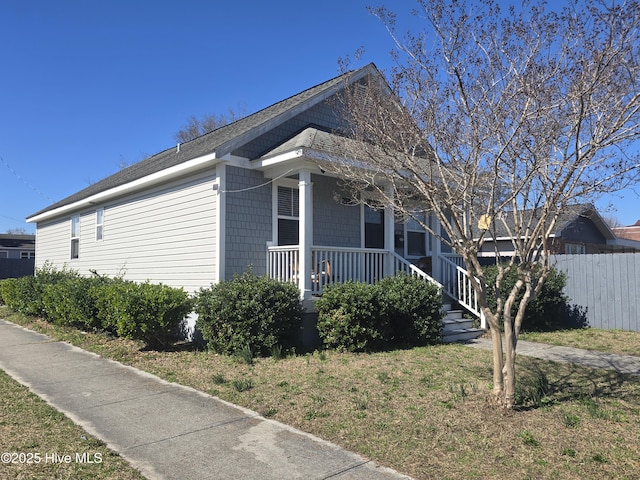 924 S 11th St, Wilmington, NC 28401 - view of front of house with a porch, fence, and roof with shingles