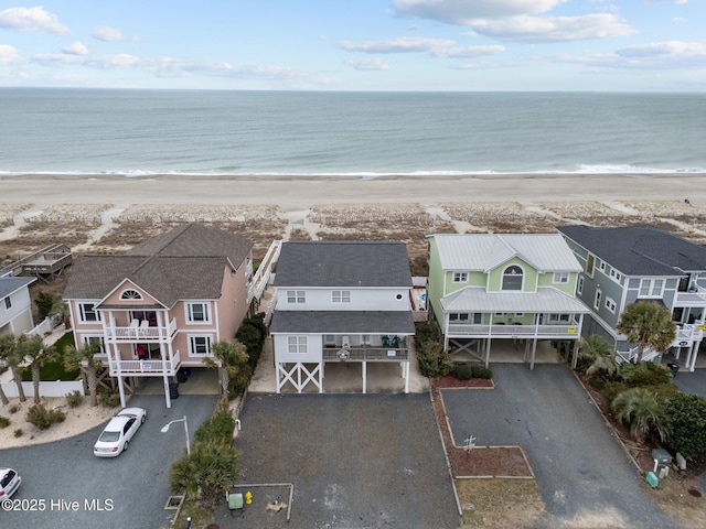 bird's eye view featuring a beach view, a residential view, and a water view