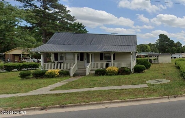 view of front of house with a porch and a front yard