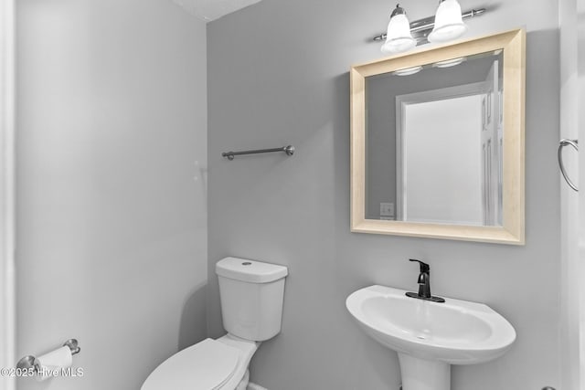 bathroom with sink and toilet