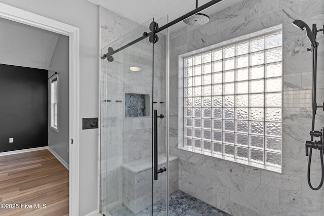 6148 Sugar Pine Dr, Wilmington, NC 28412 - full bathroom with a marble finish shower, baseboards, and wood finished floors