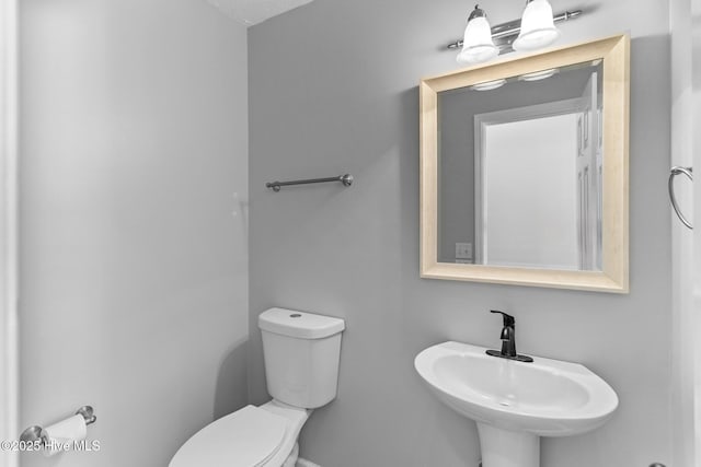 6148 Sugar Pine Dr, Wilmington, NC 28412 - bathroom featuring toilet and a sink