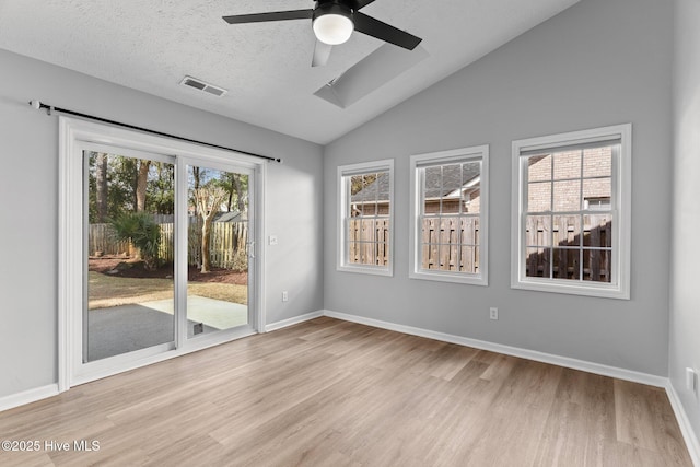 6148 Sugar Pine Dr, Wilmington, NC 28412 - spare room with wood finished floors, ceiling fan, vaulted ceiling, and baseboards