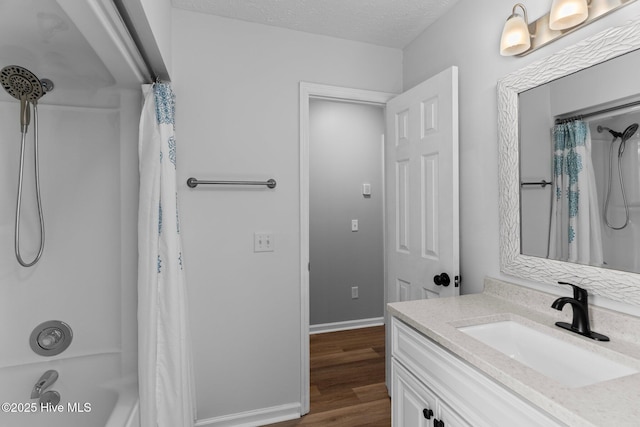 6148 Sugar Pine Dr, Wilmington, NC 28412 - full bathroom with vanity, wood finished floors, shower / tub combo with curtain, and baseboards