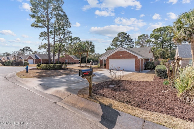 6148 Sugar Pine Dr, Wilmington, NC 28412 - view of front of home with driveway, brick siding, and an attached garage