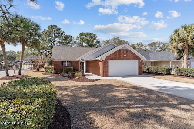 6148 Sugar Pine Dr, Wilmington, NC 28412 - ranch-style house with brick siding, an attached garage, and driveway