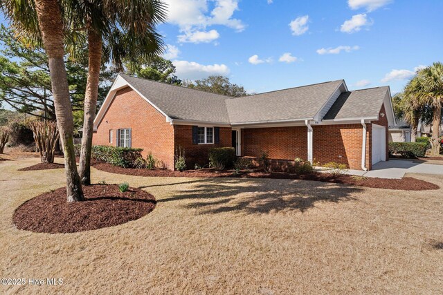 6148 Sugar Pine Dr, Wilmington, NC 28412 - single story home featuring brick siding, driveway, a garage, and a shingled roof
