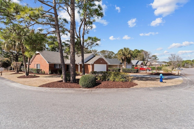 6148 Sugar Pine Dr, Wilmington, NC 28412 - ranch-style house featuring concrete driveway, a garage, brick siding, and a residential view