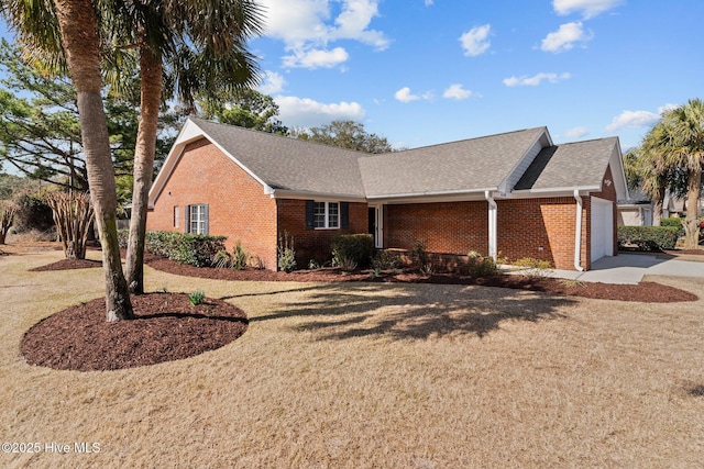 single story home with a front yard and a garage