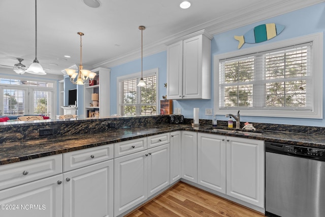 kitchen with white cabinetry, dark stone counters, stainless steel appliances, kitchen peninsula, and hanging light fixtures