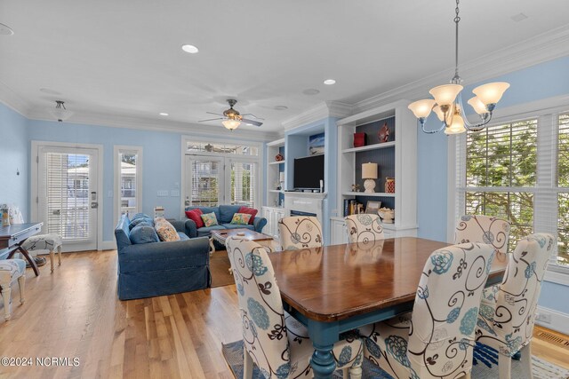 kitchen featuring light hardwood / wood-style floors, stainless steel appliances, white cabinetry, and dark stone countertops