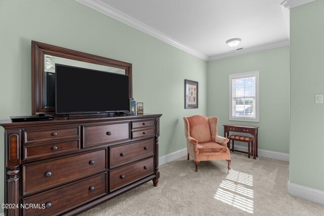 carpeted bedroom with ornamental molding, ensuite bathroom, and ceiling fan
