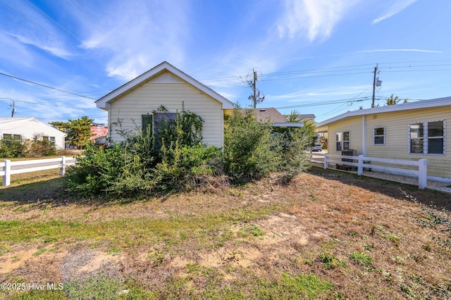 view of side of property with fence