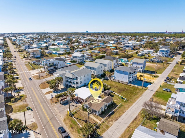 birds eye view of property with a residential view