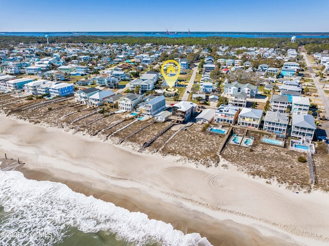 aerial view featuring a water view and a beach view