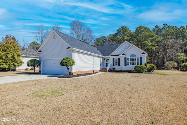 view of front of property featuring a front yard and a garage