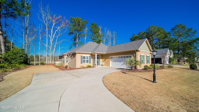 view of front facade with a garage and a front lawn