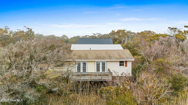 back of property featuring a wooden deck