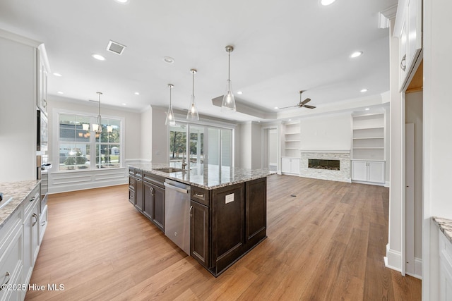 interior space with crown molding, light wood-style flooring, and a chandelier