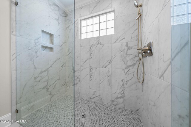 full bath with marble finish floor, a sink, toilet, and crown molding