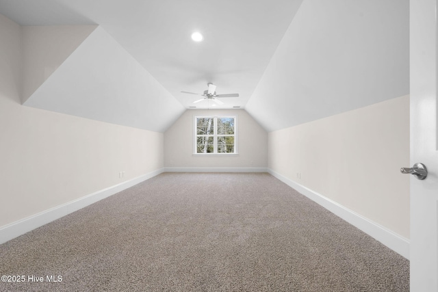 bonus room featuring carpet flooring, baseboards, a ceiling fan, and vaulted ceiling