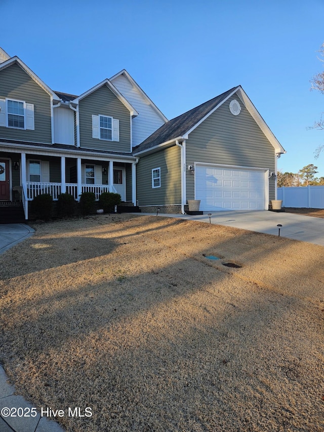 view of front facade with a garage and covered porch