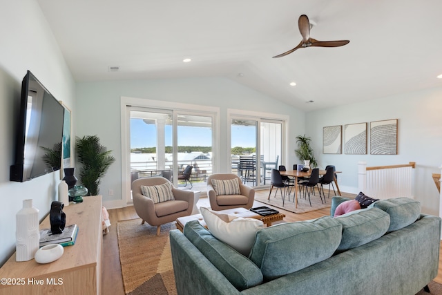 living room with visible vents, a ceiling fan, wood finished floors, vaulted ceiling, and recessed lighting