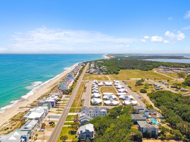 aerial view with a water view and a beach view